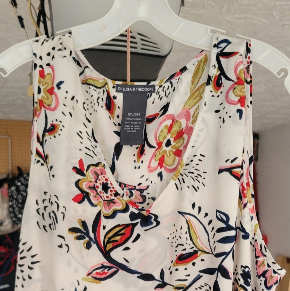 Various tops and dresses. All pieces are 2XL
